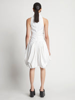 Back image of model wearing Technical Nylon Dress in optic white