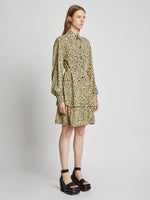 Side image of model wearing Printed Leopard Shirt Dress in butter multi
