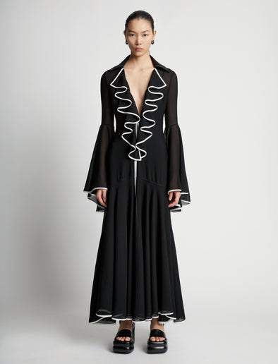 Front image of model wearing Solid Mesh Ruffle Dress in black