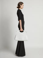 Image of model carrying Bar Bag in OPTIC WHITE