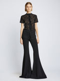 Front image of model wearing Stretch Lace Top in black