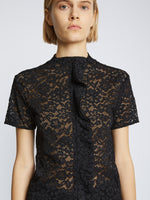 Detail image of model wearing Stretch Lace Top in black