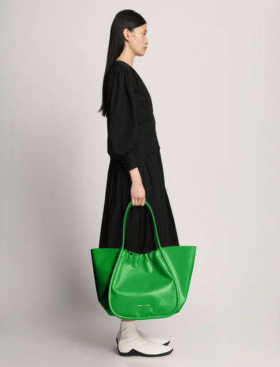 Image of model wearing XL Ruched Tote in BOTTLE GREEN