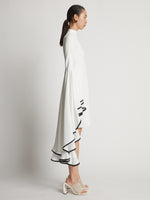 Side image of model wearing Viscose Crepe Dress in off white