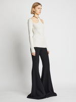 Side image of model wearing Chain Detail Viscose Knit Sweater in off white