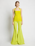 Front image of model wearing Viscose Knit Halter Top in sulphur