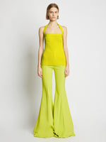 Front image of model wearing Viscose Knit Halter Top in sulphur
