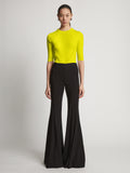 Front image of model wearing Viscose Knit Top in sulphur