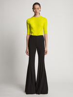 Front image of model wearing Viscose Knit Top in sulphur