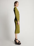 Side image of model wearing Viscose Knit Dress in olive