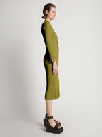 Side image of model wearing Viscose Knit Dress in olive