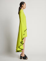 Side image of model wearing Viscose Crepe Dress in bright green