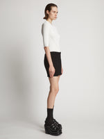 Side image of model wearing Boucle Tweed Skirt in black