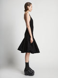 Side image of model wearing Stretch Nylon Dress in black