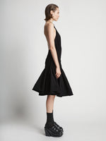 Side image of model wearing Stretch Nylon Dress in black