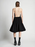 Back image of model wearing Stretch Nylon Dress in black