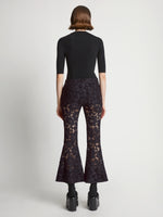 Back image of model wearing Lace Pants in black