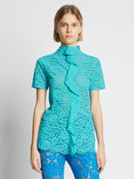 Cropped front image of model wearing Stretch Lace Top in cyan