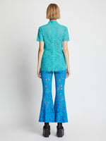 Back image of model wearing Stretch Lace Top in cyan