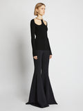 Side image of model wearing Chain Detail Viscose Knit Sweater in black