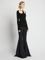 Side image of model wearing Chain Detail Viscose Knit Sweater in black