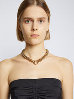 Detail image of model wearing Chain Detail Viscose Knit Sweater in black