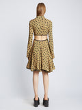 Back image of model wearing Printed Dot Cut Out Shirt Dress in khaki black