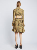 Back image of model wearing Printed Dot Cut Out Shirt Dress in khaki black