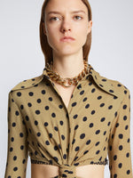 Detail image of model wearing Printed Dot Cut Out Shirt Dress in khaki black
