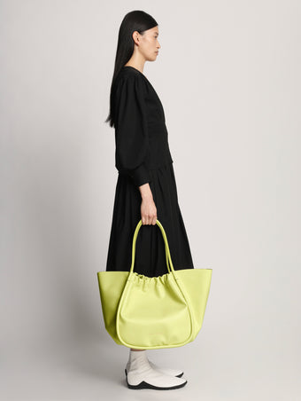 Image of model wearing XL Ruched Tote in LEMONGRASS