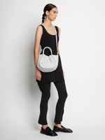 Model wearing Small Ruched Crossbody Tote in optic white