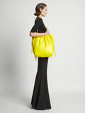 Image of model wearing Drawstring Tote in CANARY YELLOW