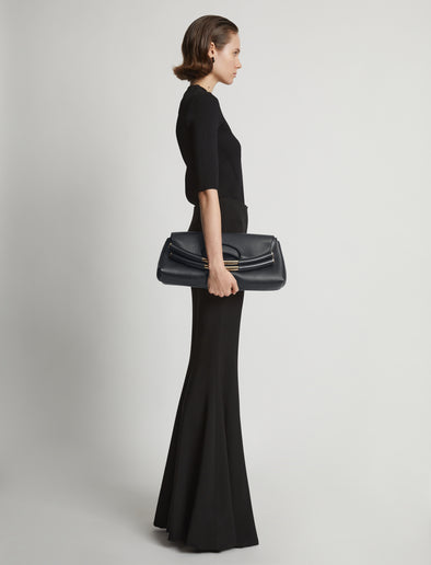 Image of model carrying Bar Bag in BLACK