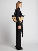 Image of model carrying Raffia Large Ruched Tote in BLACK/SAND