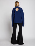 Back full length image of model wearing Eco Cashmere Oversized Sweater in COBALT