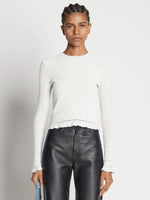 Cropped front image of model wearing Cropped Turtleneck Chenille Sweater in off white