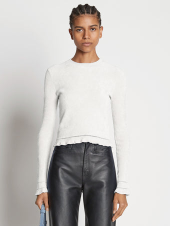 Cropped front image of model wearing Cropped Turtleneck Chenille Sweater in off white