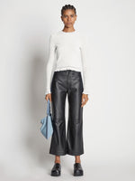Front image of model wearing Cropped Turtleneck Chenille Sweater in off white