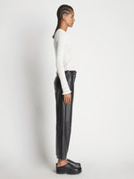 Side image of model wearing Cropped Turtleneck Chenille Sweater in off white