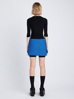 Back image of model wearing Boucle Tweed Skirt in turquoise