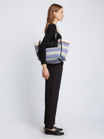 Image of model carrying Large Morris Stripe Canvas Tote in BLACK/WHITE/COBALT on shoulder