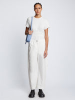 Front image of model carrying Watts Leather Camera Bag in PERIWINKLE