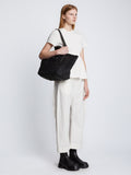 Image of model carrying Large Morris Raffia Tote in BLACK on shoulder