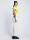 Image of model carrying Small Chrystie Bag in LIME on shoulder