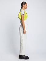 Image of model carrying Small Chrystie Bag in LIME on shoulder