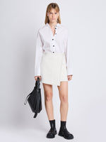 Front full length image of model wearing Tweed Wrap Skirt in OFF WHITE