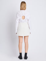 Back full length image of model wearing Tweed Wrap Skirt in OFF WHITE