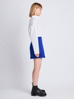 Side full length image of model wearing Tweed Wrap Skirt in ROYAL BLUE
