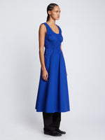 Side full length image of model wearing Poplin Gathered Dress in ROYAL BLUE