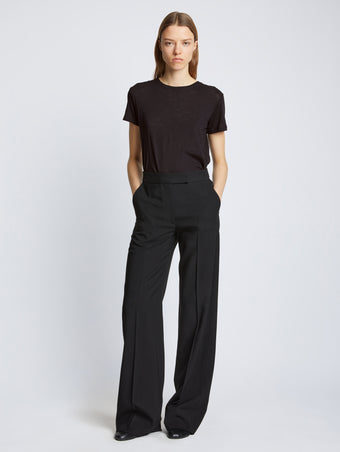 Front full length image of model wearing Short Sleeve T-Shirt in BLACK